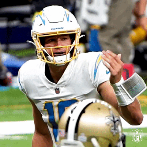A Football Player Wearing A White Jersey With The Number 10 On It GIF