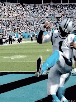 A Football Player With The Number 1 On His Jersey Is Being Lifted Up By Another Player GIF