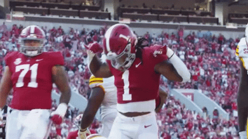 A Football Player With The Number 1 On His Jersey Is Celebrating GIF