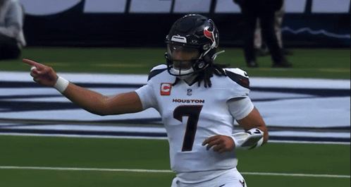 A Football Player With The Number 1 On His Jersey Is Pointing GIF