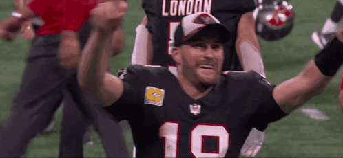 A Football Player With The Number 10 On His Jersey Is Celebrating GIF