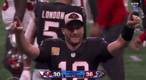 A Football Player With The Number 10 On His Jersey Is Celebrating GIF