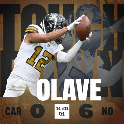 A Football Player With The Number 12 On His Jersey Catching A Ball GIF