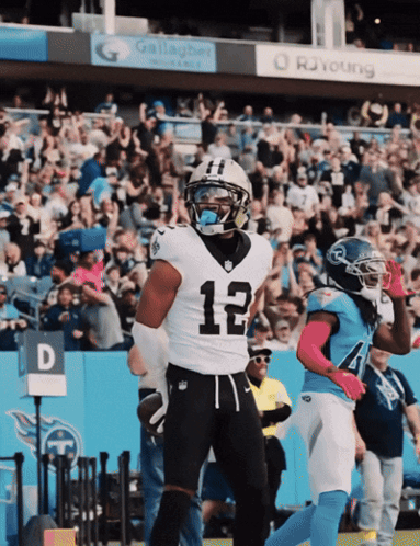 A Football Player With The Number 12 On His Shirt GIF
