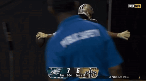 A Football Player With The Number 12 On The Back Of His Shirt GIF