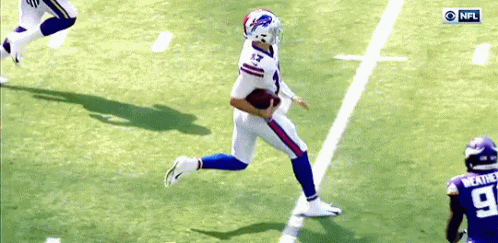 A Football Player With The Number 13 On His Jersey Runs With The Ball GIF