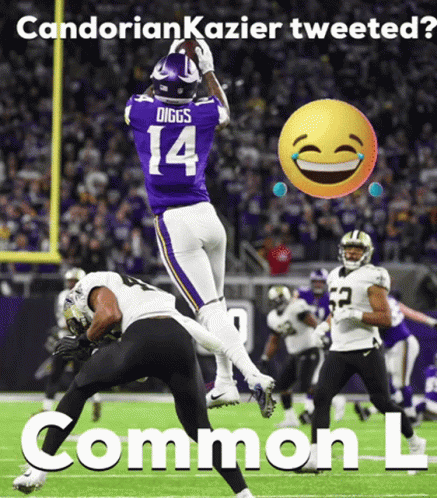 A Football Player With The Number 14 On His Jersey Catching A Ball GIF