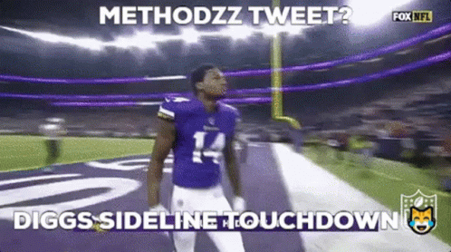 A Football Player With The Number 14 On His Jersey Stands On The Field . GIF