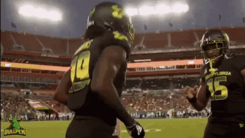 A Football Player With The Number 15 On His Jersey Is Running On The Field GIF