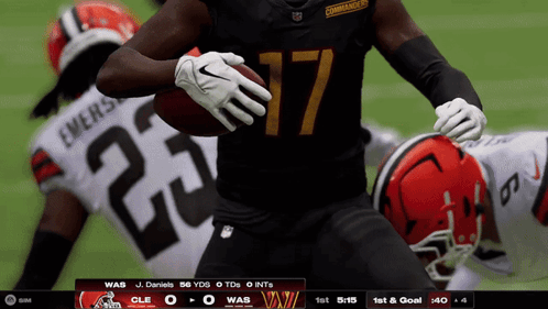 A Football Player With The Number 17 On His Jersey Is Running With The Ball GIF
