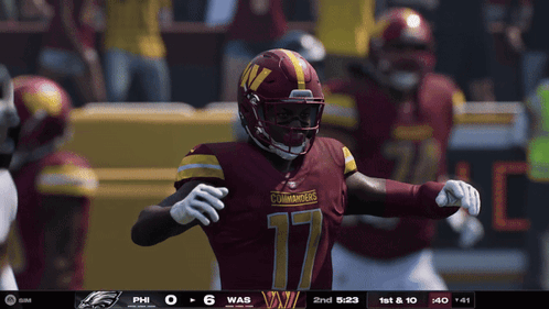 A Football Player With The Number 17 On His Jersey Stands On The Field GIF
