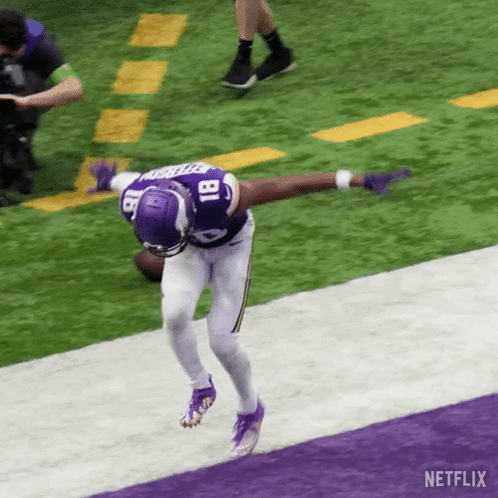 A Football Player With The Number 18 On His Jersey Is Running On The Field GIF