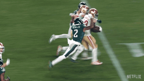 A Football Player With The Number 19 On His Jersey Is Running On The Field GIF