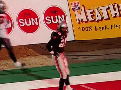 A Football Player With The Number 2 On His Jersey Is Standing On The Field GIF