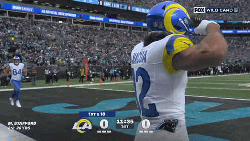 A Football Player With The Number 2 On His Jersey Stands On The Field GIF