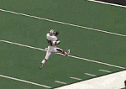 A Football Player With The Number 21 On His Jersey Is Running On A Field GIF