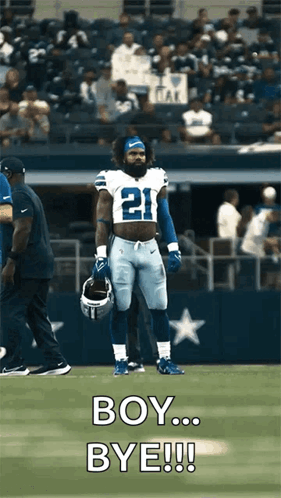 A Football Player With The Number 21 On His Jersey Is Standing On The Field GIF