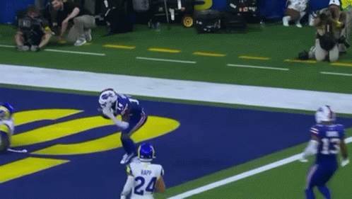 A Football Player With The Number 24 On His Jersey Catches A Pass GIF
