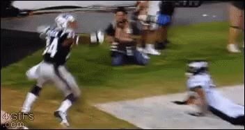 a football player with the number 24 on his jersey is running towards another player
