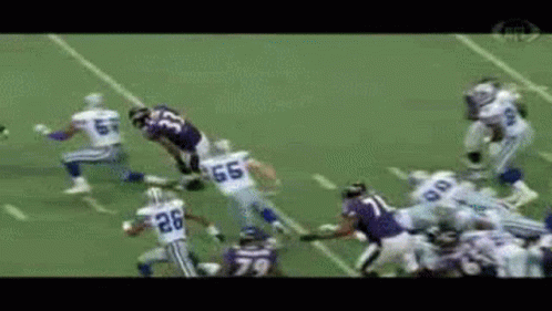 A Football Player With The Number 26 On His Jersey Is Running With The Ball GIF