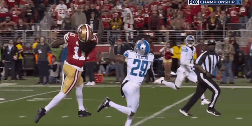 A Football Player With The Number 29 On His Jersey Is Running On The Field GIF
