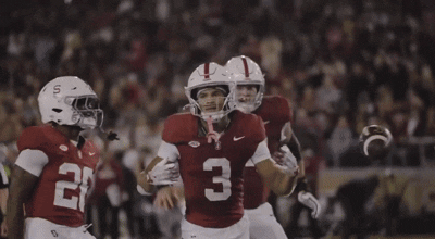 a football player with the number 3 on his jersey is being hugged by another player