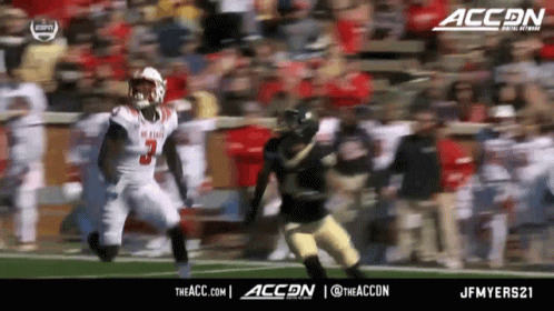 A Football Player With The Number 3 On His Jersey Is Being Tackled By Another Player GIF