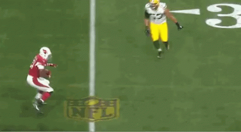 A Football Player With The Number 31 On His Jersey Is Running On The Field GIF