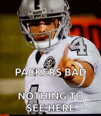 A Football Player With The Number 4 On His Jersey Is Pointing At Something . GIF