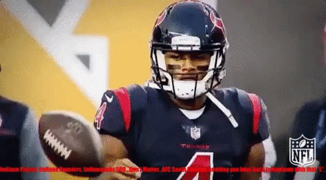 A Football Player With The Number 4 On His Jersey Throws The Ball GIF