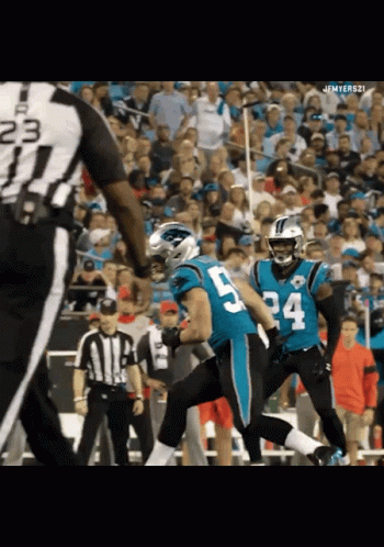 A Football Player With The Number 5 On His Jersey Runs Towards A Referee GIF