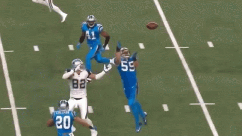 A Football Player With The Number 5 On His Jersey Runs With The Ball GIF