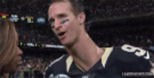A Football Player With The Number 5 On His Jersey Talking To A Woman GIF