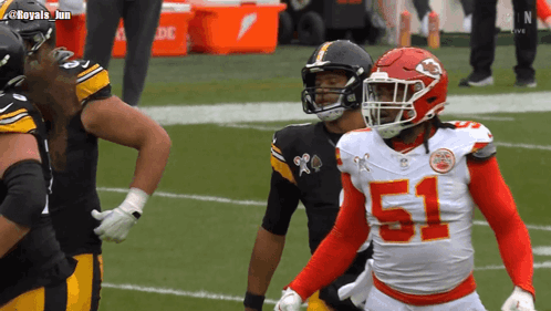 A Football Player With The Number 51 On His Jersey Stands On The Field GIF