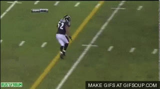 A Football Player With The Number 56 On His Back Is Laying On The Field GIF