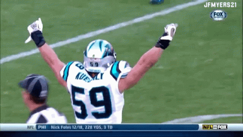 A Football Player With The Number 59 On His Jersey Celebrates GIF