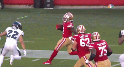A Football Player With The Number 63 On Their Jersey GIF