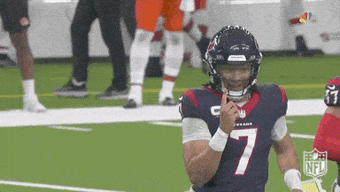 A Football Player With The Number 7 On His Jersey Holds His Finger To His Mouth . GIF