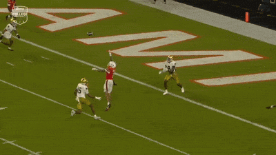A Football Player With The Number 7 On His Jersey Is Being Tackled By Another Player GIF