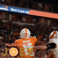 A Football Player With The Number 7 On His Jersey Is Being Tackled GIF