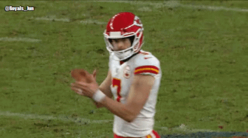 a football player with the number 7 on his jersey is giving the middle finger