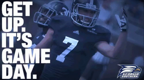 A Football Player With The Number 7 On His Jersey Stands In Front Of A Sign That Says Get Up It 'S Game Day GIF