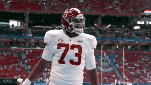 A Football Player With The Number 73 On His Shirt GIF