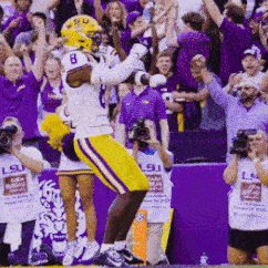 A Football Player With The Number 8 On His Helmet Celebrates GIF