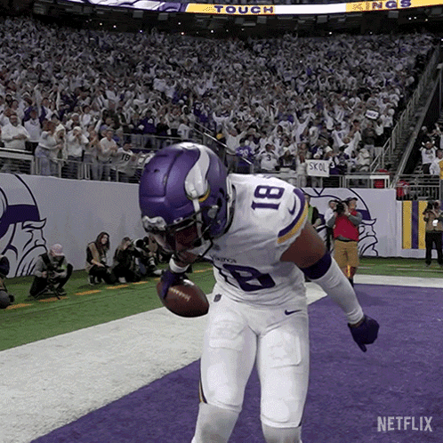 A Football Player With The Number 81 On His Jersey Is Holding A Football GIF