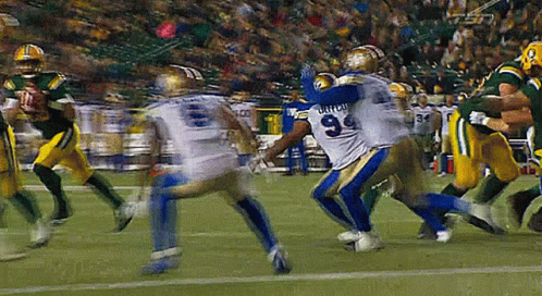 A Football Player With The Number 9 On His Jersey Is Being Tackled By Another Player GIF