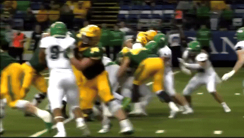 a football player with the number 9 on his jersey is being tackled