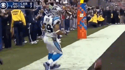 A Football Player With The Number 9 On His Jersey Is Running Down The Field GIF