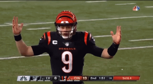 A Football Player With The Number 9 On His Jersey Stands On A Field GIF