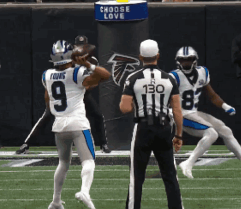 a football player with the number 9 on his jersey throws the ball
